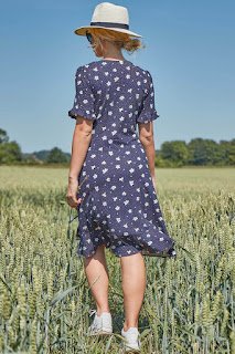 Navy floral side button tea sundress back side